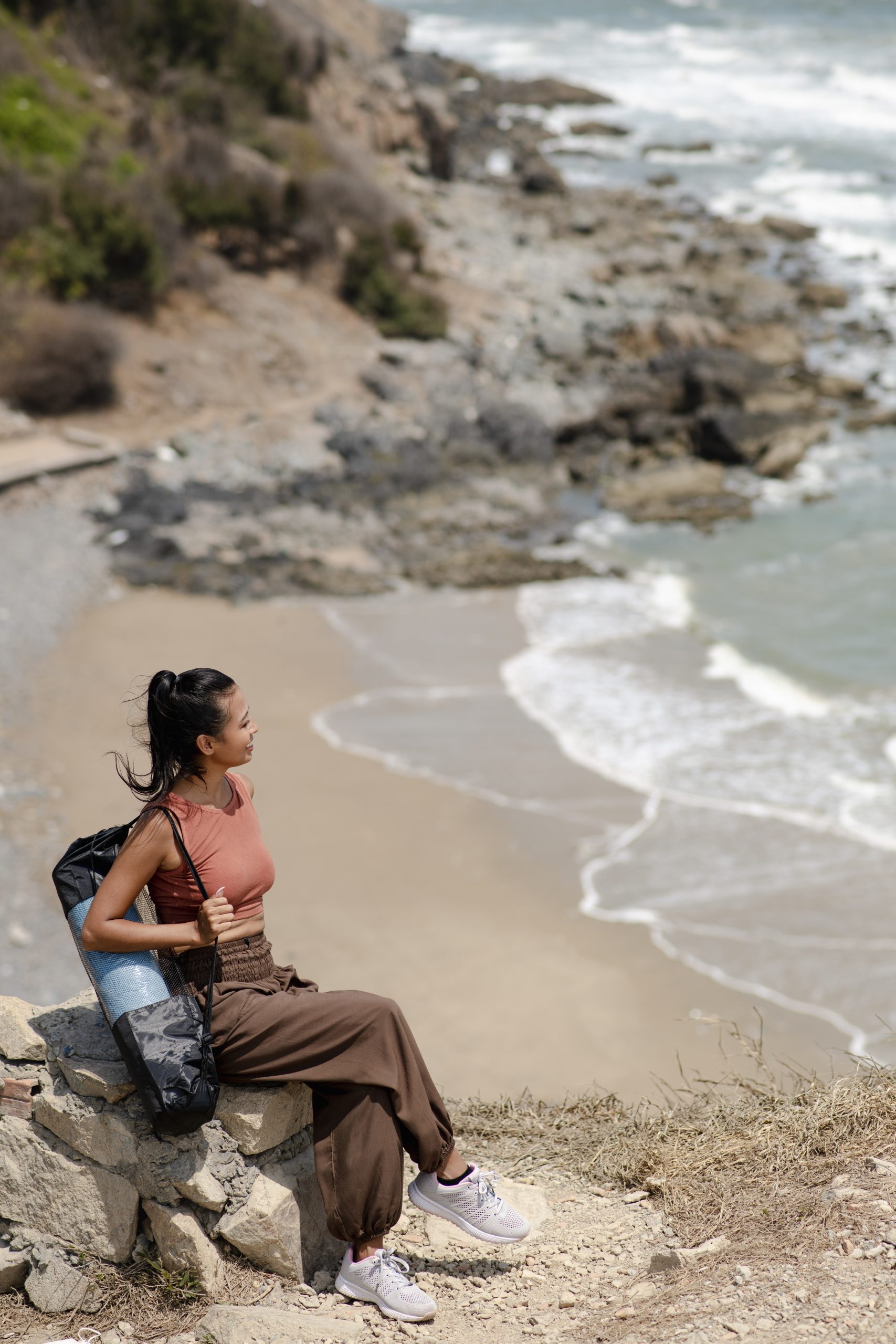 Woman enjoying a mindful wellness experience on the beach