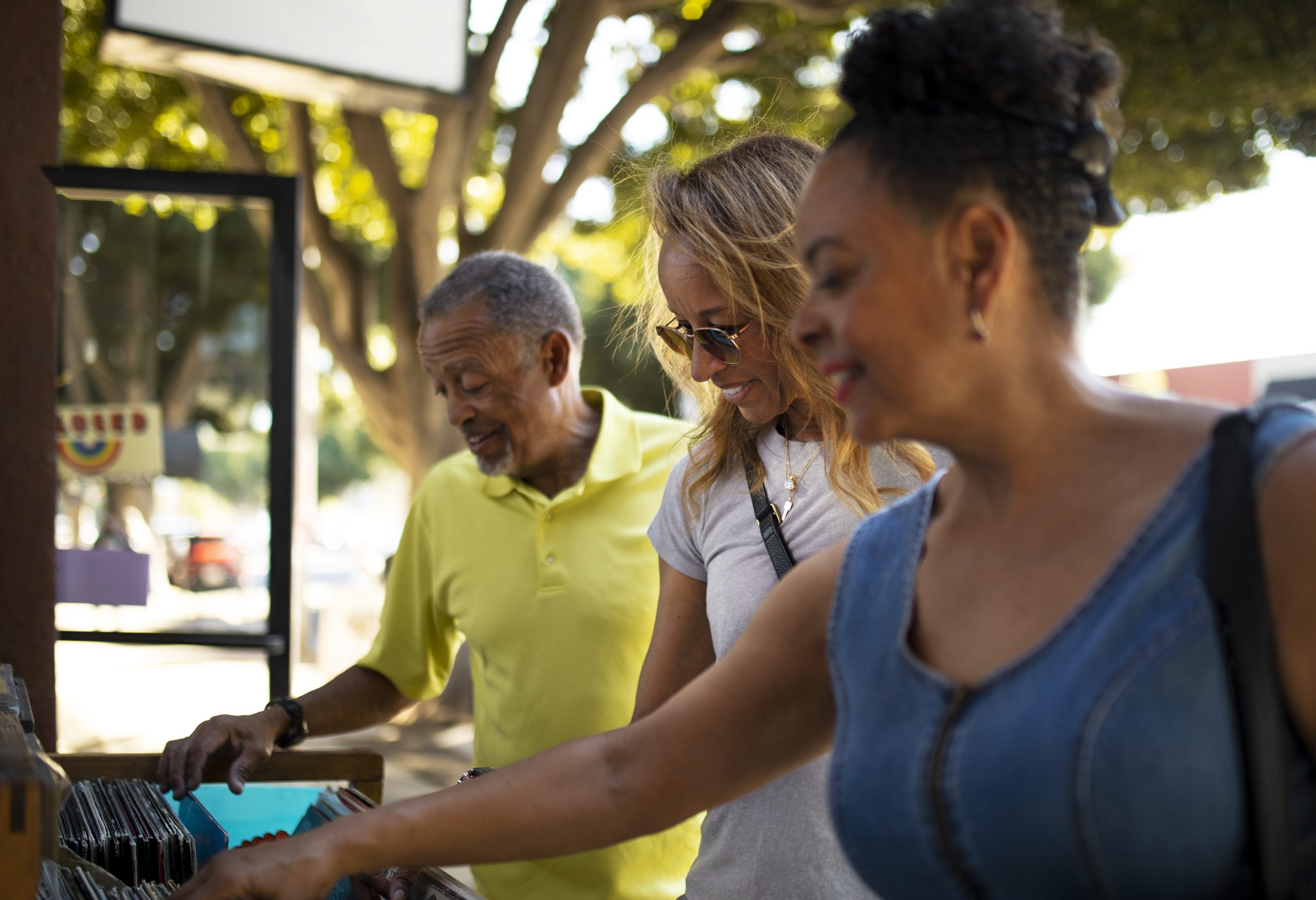 People exploring a local creative and cultural collection
